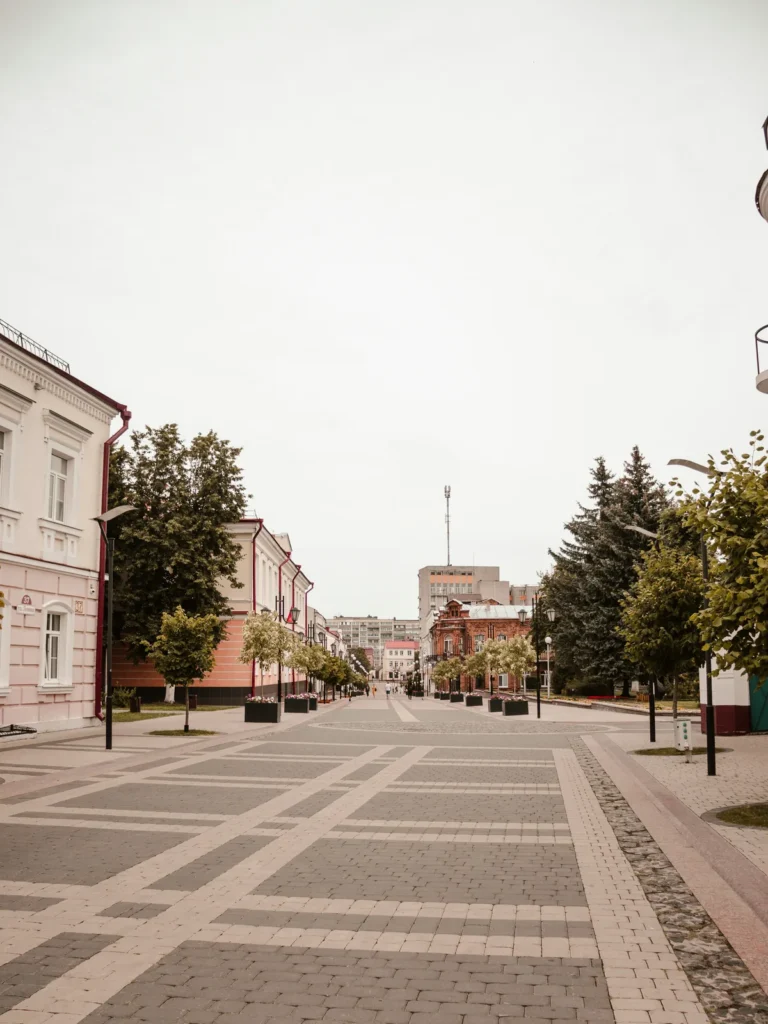 Quiet town street with a clock tower in the distance